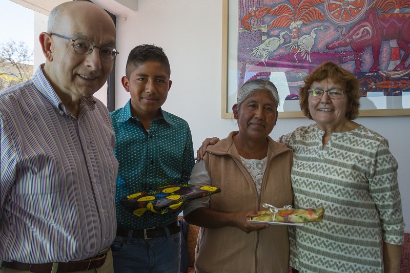 Joe and Dottie Conforti stand with their sponsored child and his mother in Mexico.