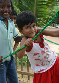 Image of a girl playing on a robe bridge in a CCF Child Centered Space