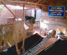 Image of Raveena, once a barber, who now assist in building and repairing boats