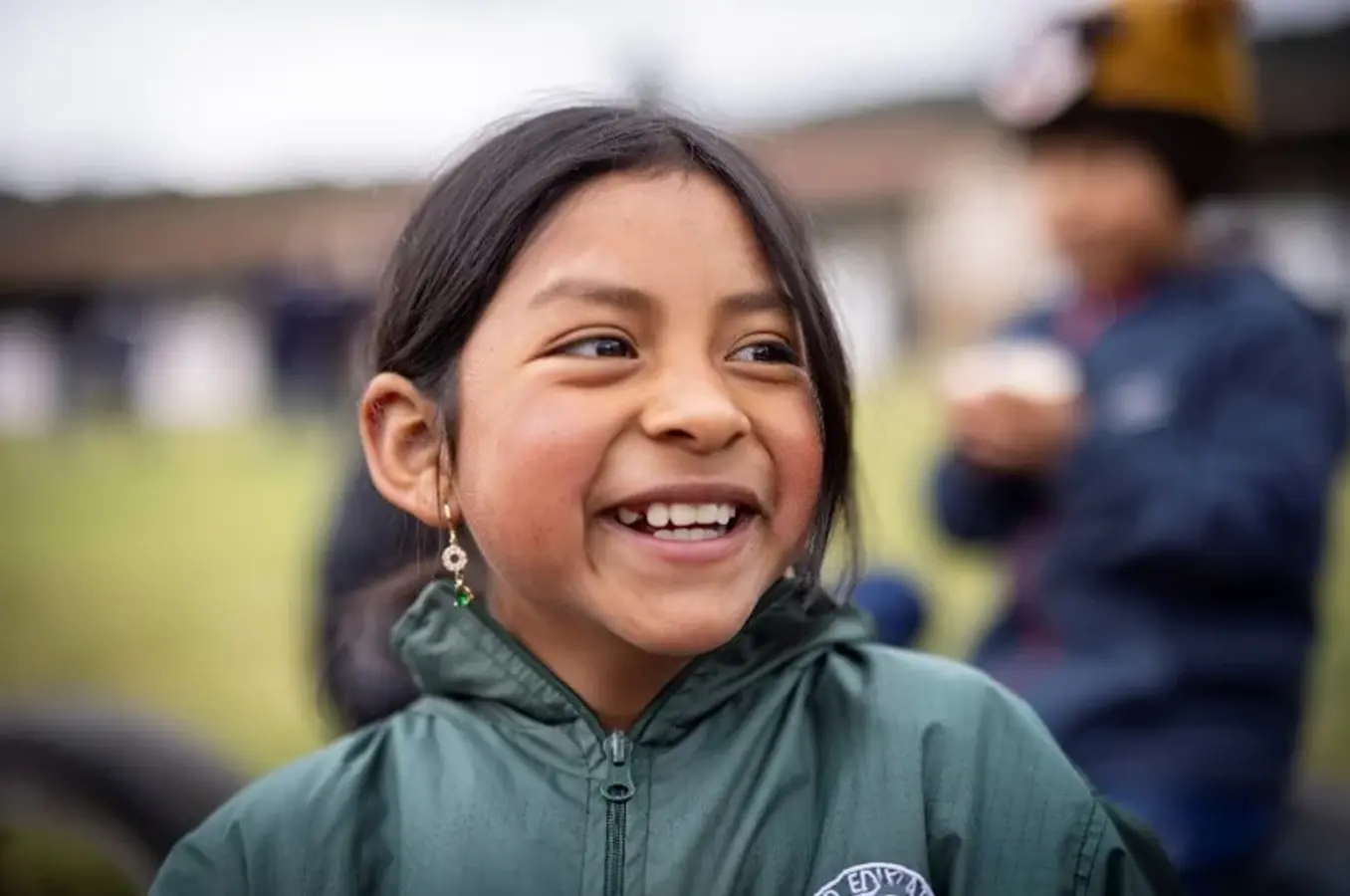 A young Ecuadorian girl smiles