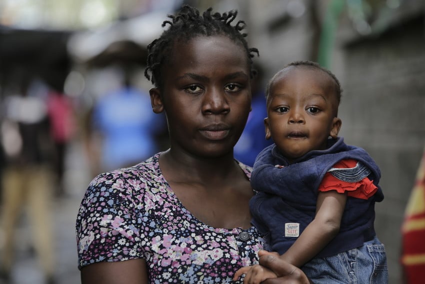 A mother holds her son in Kenya.