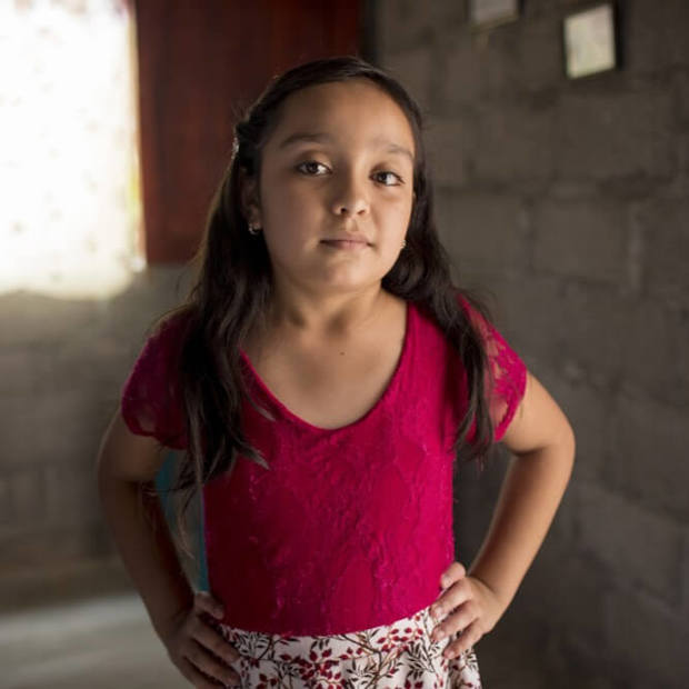Yeimi, 10, of Honduras stands tall.