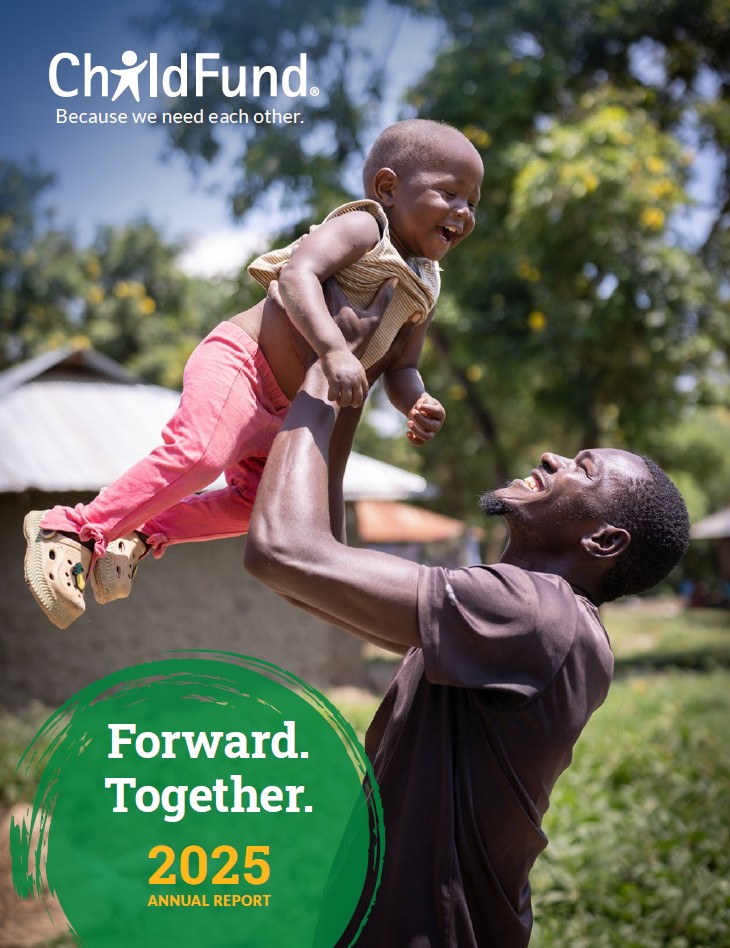 FY25 annual report cover showing a father lifting his small son, the two laughing together