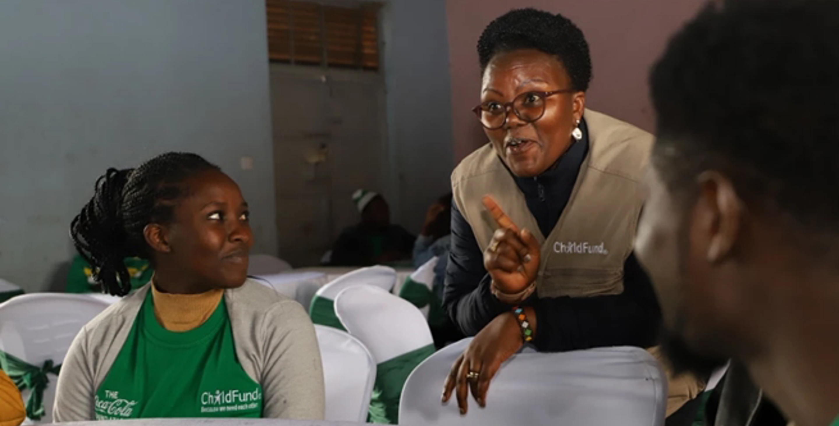 ChildFund Kenya Country Director Alice Anukur chats with youth participants during the Tunawiri na Taka project launch.