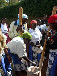 Image of community members preparing millet and maize porridge