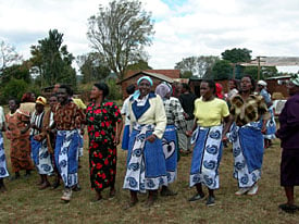 Image of community members doing a celebratory dance