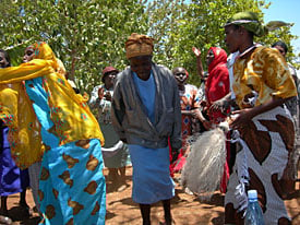 Image of parents from Mt. Kenya celebrating with song and dance