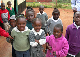 Image of children in Nairobi congregating outside a CCF early childhood development center