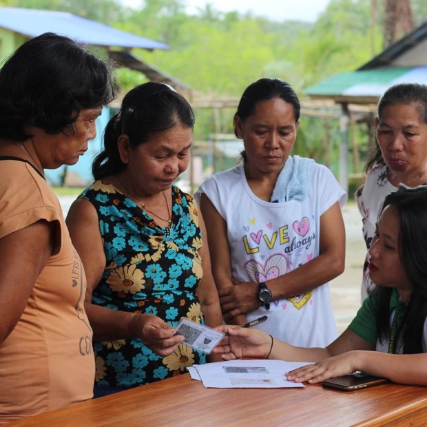 Community members in the Philippines participate in storm recovery initiatives after Typhoon Fung-Wong.
