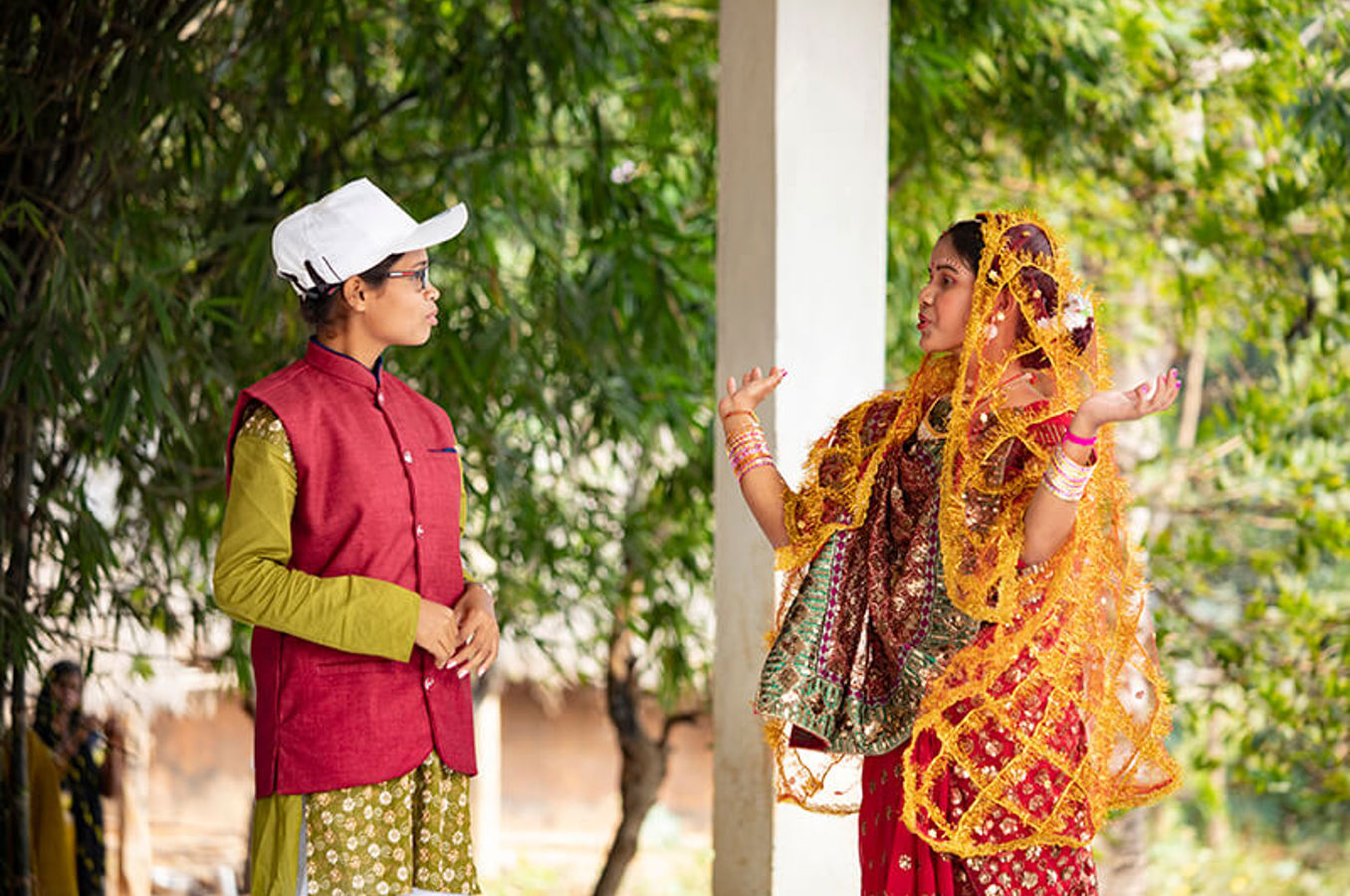 Youth club members in Keonjhar District, India, perform a street play to educate their community about the dangers of child marriage.