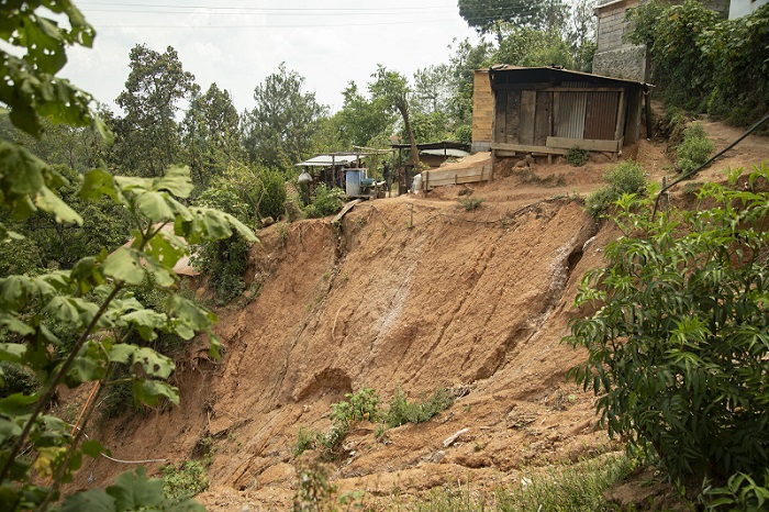 View of a steep cliff in Guatemala where a mudslide has been.