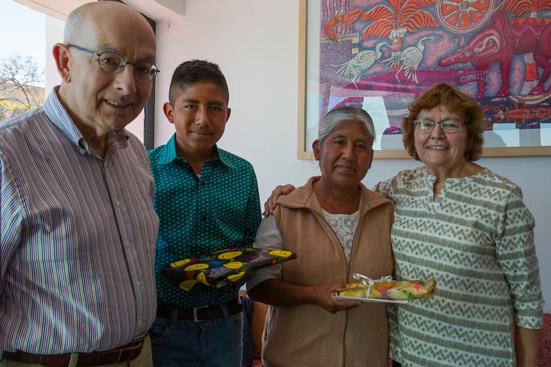 Joe and Dottie Conforti stand with their sponsored child and his mother in Mexico.