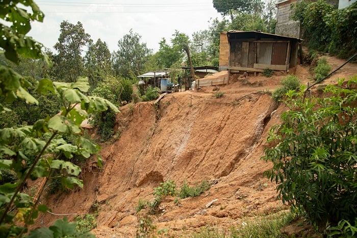 View of a steep cliff in Guatemala where a mudslide has been.