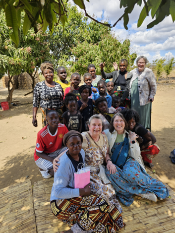 A group of people pose for a photo in Zambia.
