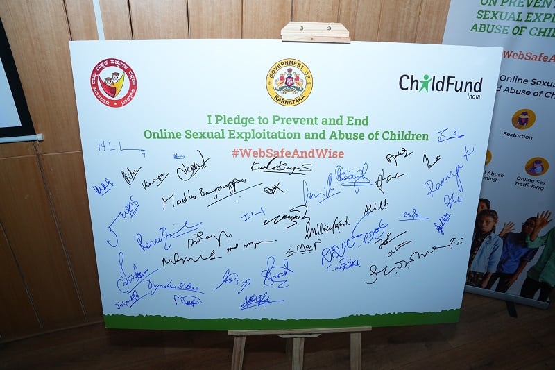 Names are displayed on a pledge board to end OSEAC.