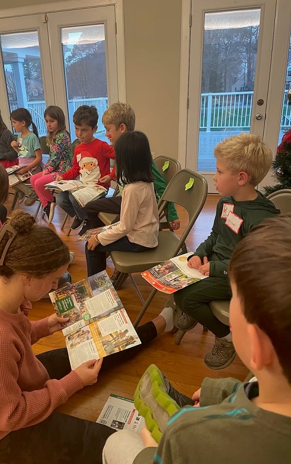 Students sit in a circle, discussing ChildFund's Real Gifts Catalog.