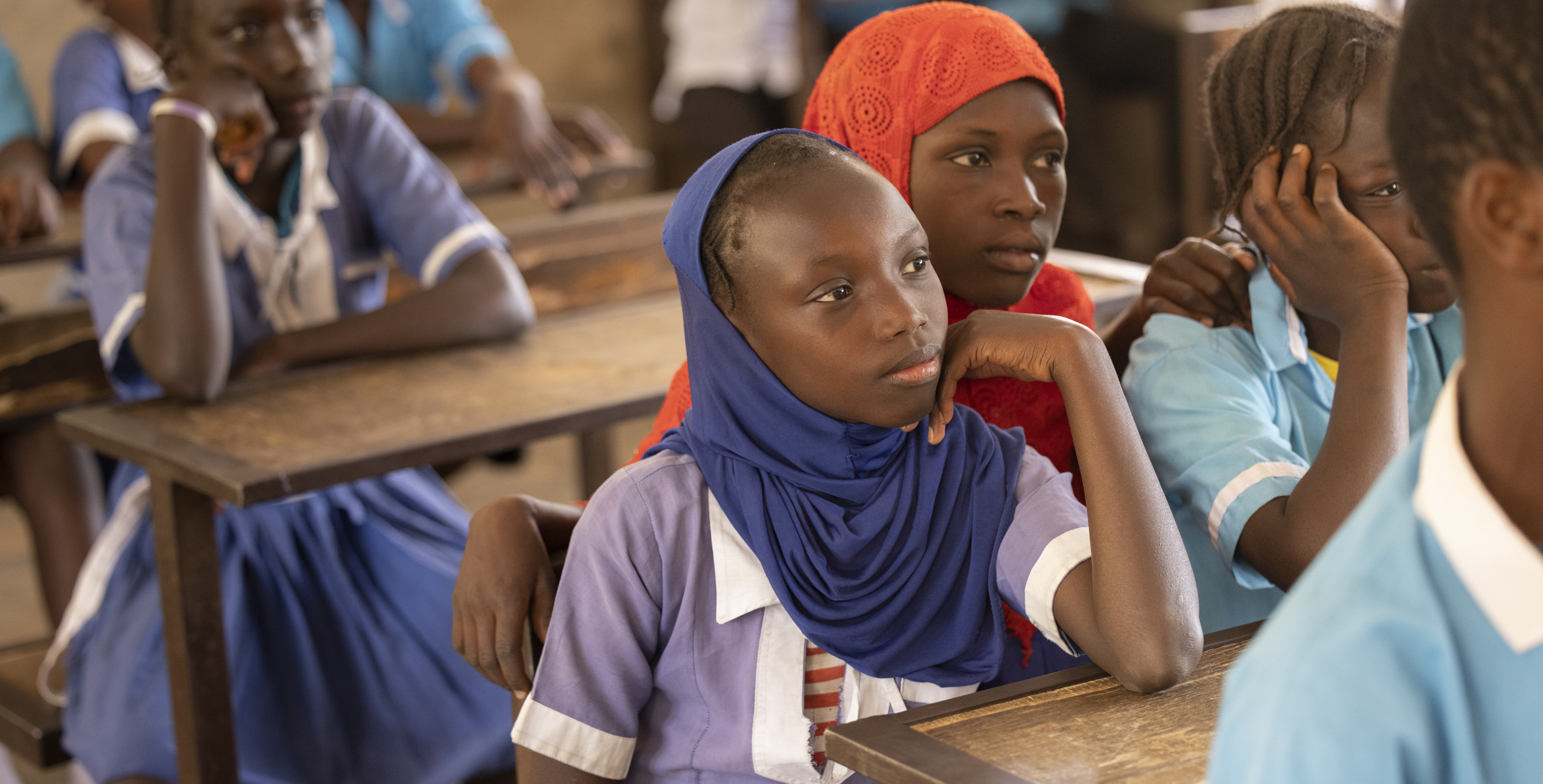 4th graders listen in class in The Gambia