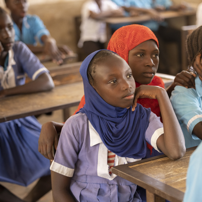 4th graders listen in class in The Gambia