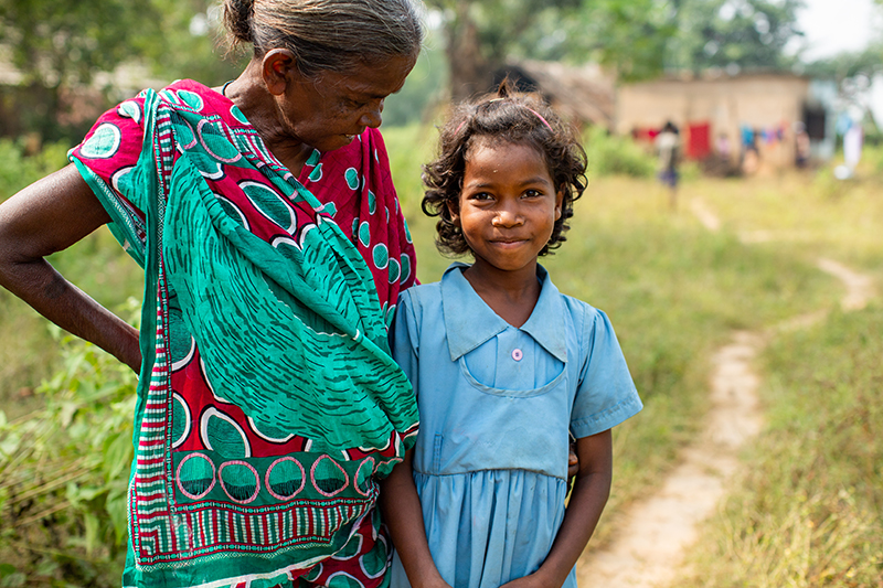 Jhunu, 8, with her grandmother in Keonjhar District, India.
